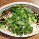 Chipotle brisket bowl covered in lettuce
